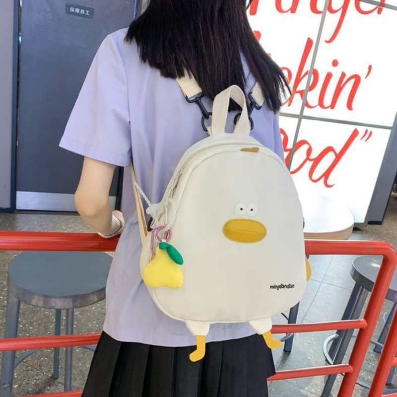 Duck Fabric Backpack|With Pear Charm – Black|With Pear Charm – Green|With Pear Charm – White|With Pear Charm – Yellow|Without Charm – Black|Without Charm – Green|Without Charm – White|Without Charm – Yellow|One Size