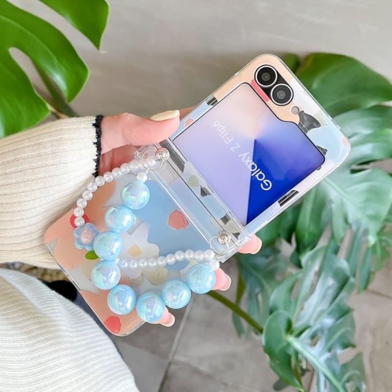 / Floral Phone Set Strap Case|Phone Case – Floral – Blue & Pink|Phone Case – Floral – Pink & Purple|Set Of 2 – Phone Case & Blue Strap – Floral – Blue & Pink|Set Of 2 – Phone Case & Yellow Strap – Floral – Pink & Purple|Z Flip 5|Z Flip 6