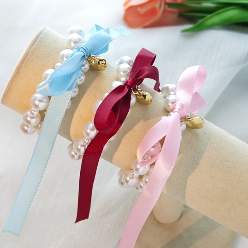 Bow Faux Pearl Bracelet|S035 – Pink|S036 – White|S037 – Black|S038 – Blue|S039 – Wine Red|One Size