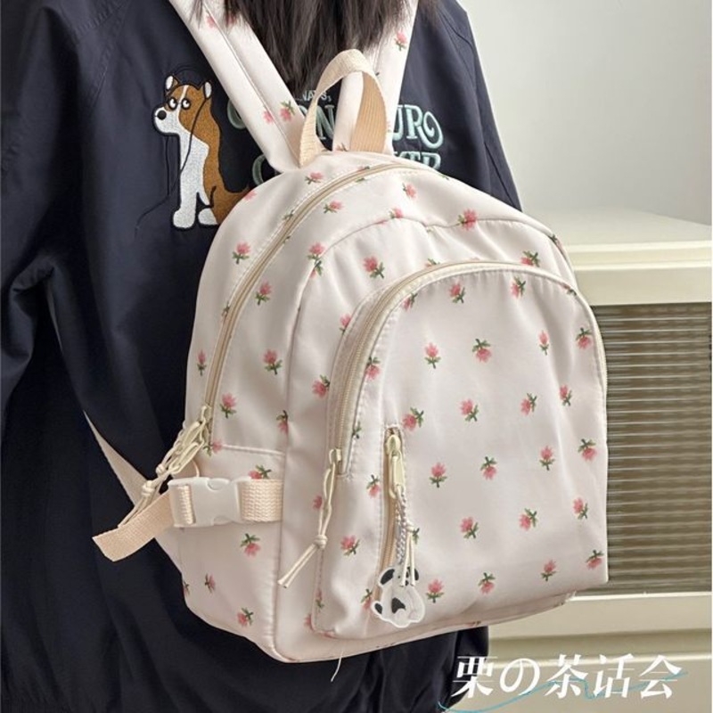 Floral Print Backpack|With Peach Face Charm – Black|With Peach Face Charm – Grayish Blue|With Peach Face Charm – Off-White|With Peach Face Charm – Pink|Without Bag Charm – Black|Without Bag Charm – Grayish Blue|Without Bag Charm – Off-White|Without Bag Ch